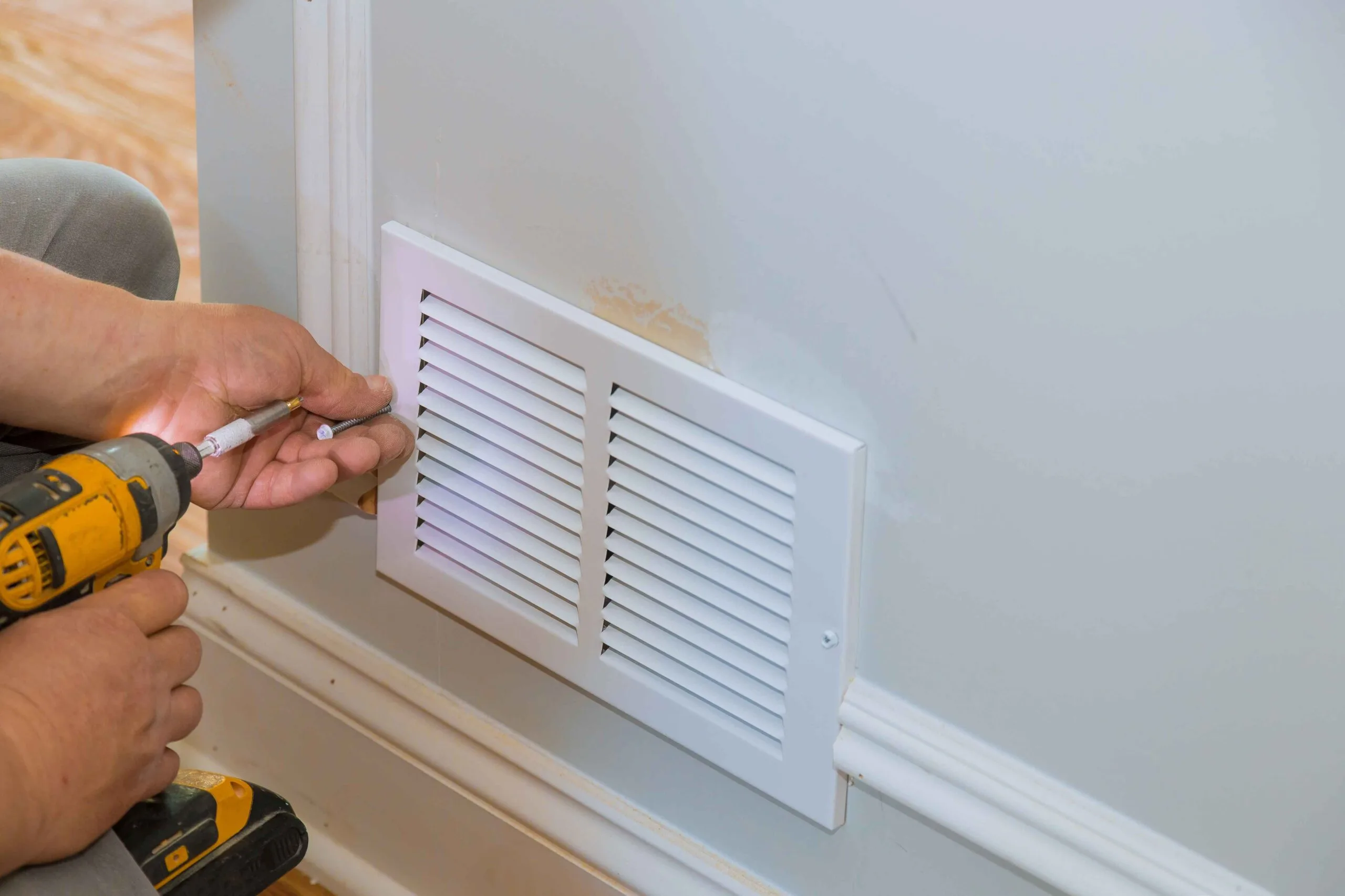technician installing air vent cover after cleaning in lees summit home