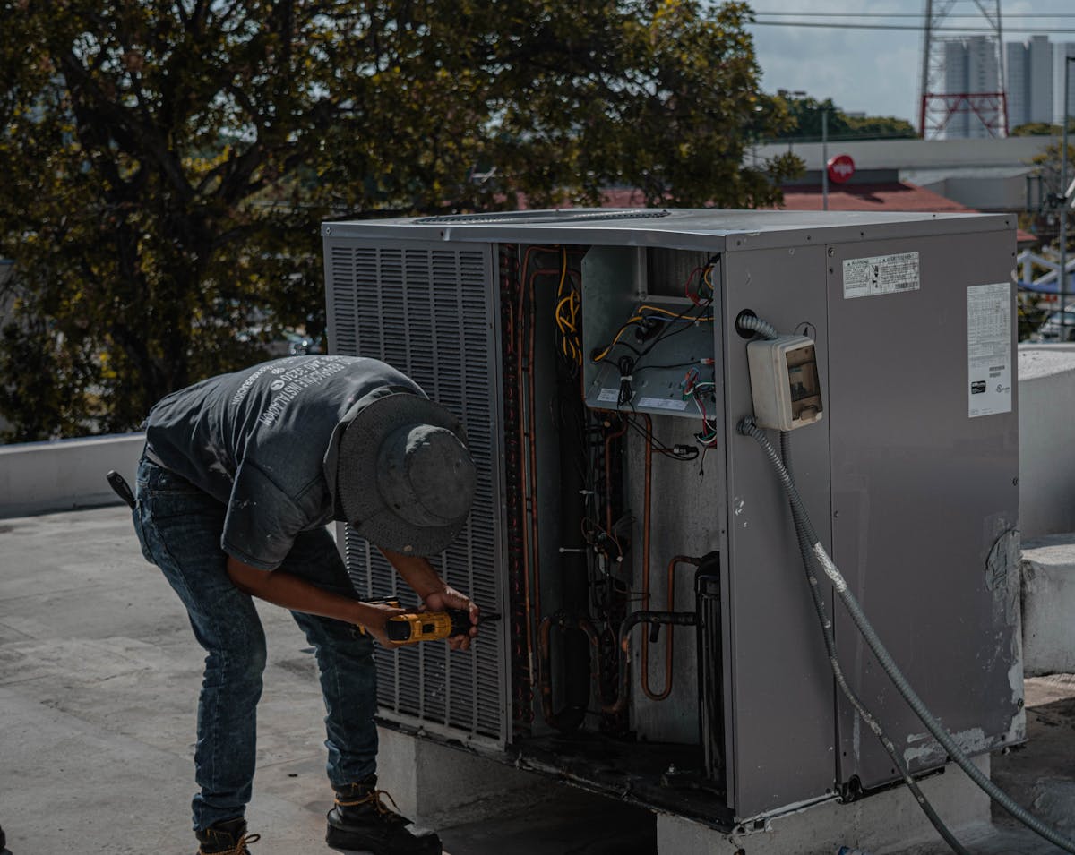Professional technician inspecting HVAC ductwork for mold and contamination
